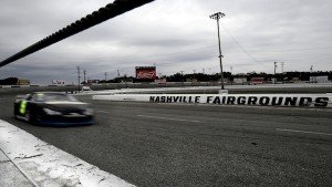 A race car driver zooms past the grandstand during an “open practice” day at Nashville Fairgrounds Speedway in late October, one week before the season-ending All American 400 / Photo by Bill Hobbs Photography billhobbs.com