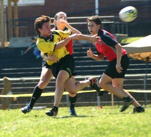 A Nashville Stone Lion pitches the ball before being tackled in Nashville’s home opening match. / Photo by Matthew Maxey