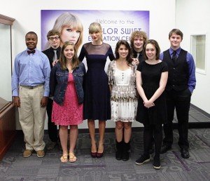 Taylor Swift (center) with a group of Metro Nashville students at the ribbon-cutting ceremony for the Taylor Swift Education Center at the Hall of Fame COURTESY OF THE CMHOF / PHOTO BY ROYCE DEGRIE / TAS, GETTY IMAGES ENTERTAINMENT