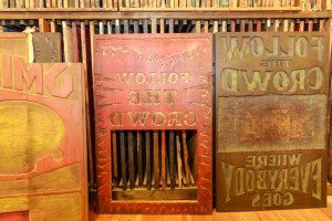 In a world where “zoom out” is not available, a big poster requires a big block, as seen here in these waist-high wooden designs. PHOTO BY RUSS CORLEY