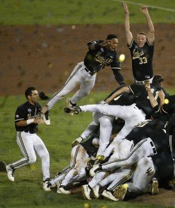 Vanderbilt players, including Vince Conde (left), John Norwood (airborne) and Franklin’s Brian Miller (33) dogpile on the pitcher’s mound at T.D. Ameritrade Park after VU defeated Virginia in the national title game. PHOTO COURTESY OF VANDERBILT UNIVERSITY