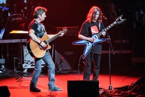 Jack Maxwell puts down his violin to play electric guitar alongside CTS founder, songwriter, singer and guitarist Jeff Senour. / Photo courtesy of Leann Austin at MCYO