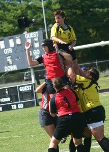 Nashville (yellow) and Knoxville (red) teams raise a player to fight for possession on a toss in. / Photo by Matthew Maxey