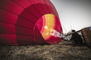 A couple of hot air balloons end their evening trips in a field north of Franklin. PHOTO BY BILL HOBBS