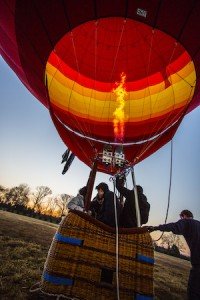 Jake Thomas, a pilot with Middle Tennessee Hot Air Adventures, prepares for liftoff with the family of David and Sumi Flagg of Hawaii in the basket for a sunrise balloon trip over Williamson County in mid-March. PHOTO BY BILL HOBBS