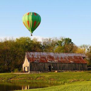 Hot air balloon owned by Robert Grimes of Ace High Ballooning flies over historic Harlinsdale Farm in Franklin in April 2013. PHOTO BY BILL HOBBS