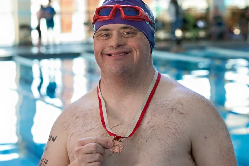 Swimmers like Aaron are able to earn medals in local and out of state swim meets. PHOTO COURTESY NASHVILLE DOLPHINS