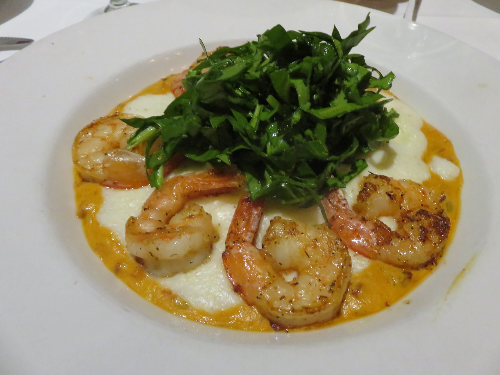 Mere Bulles makes its shrimp and grits with buttermilk and goat cheese, adding a decadent twist to a southern favorite. PHOTO BY ROXANE ATWOOD