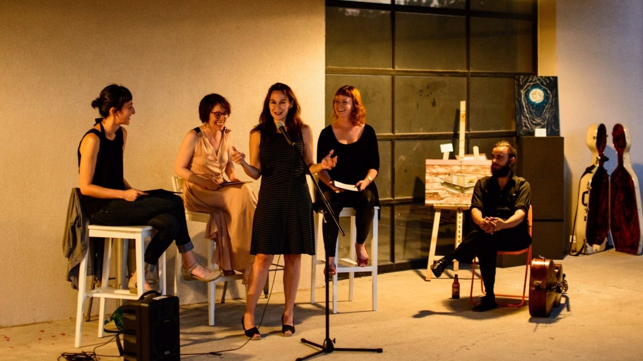 Susannah Felts of The Porch Writers Collective (standing) hosts a recent event. PHOTO COURTESY THE PORCH
